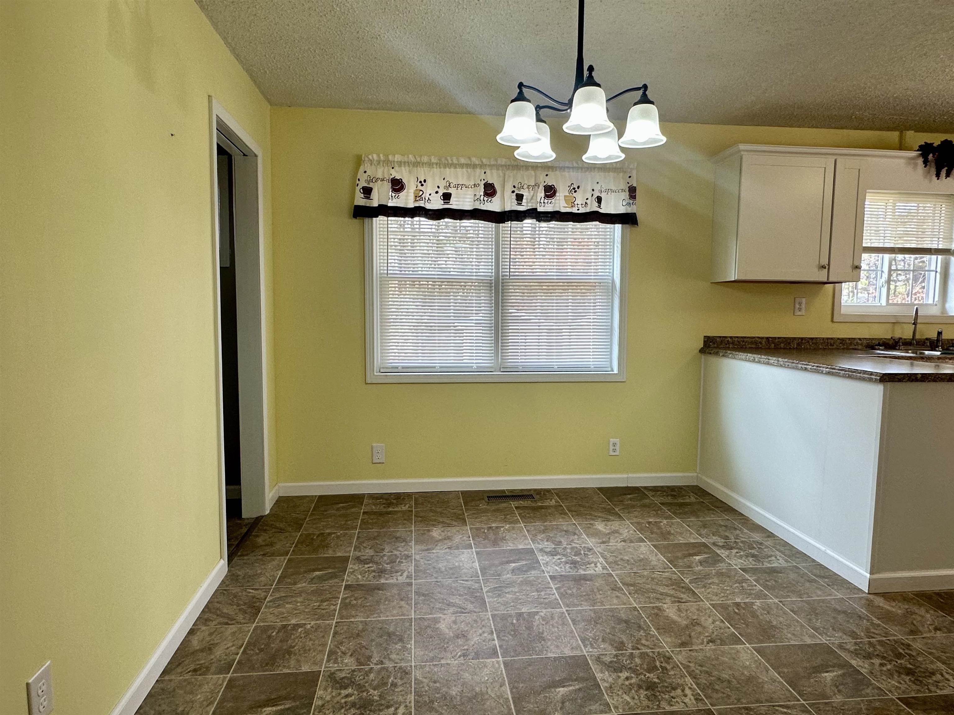 170 Mitchell Street Selmer, TN 38375 - Photo 15 of 26 a bathroom with a sink and a mirror