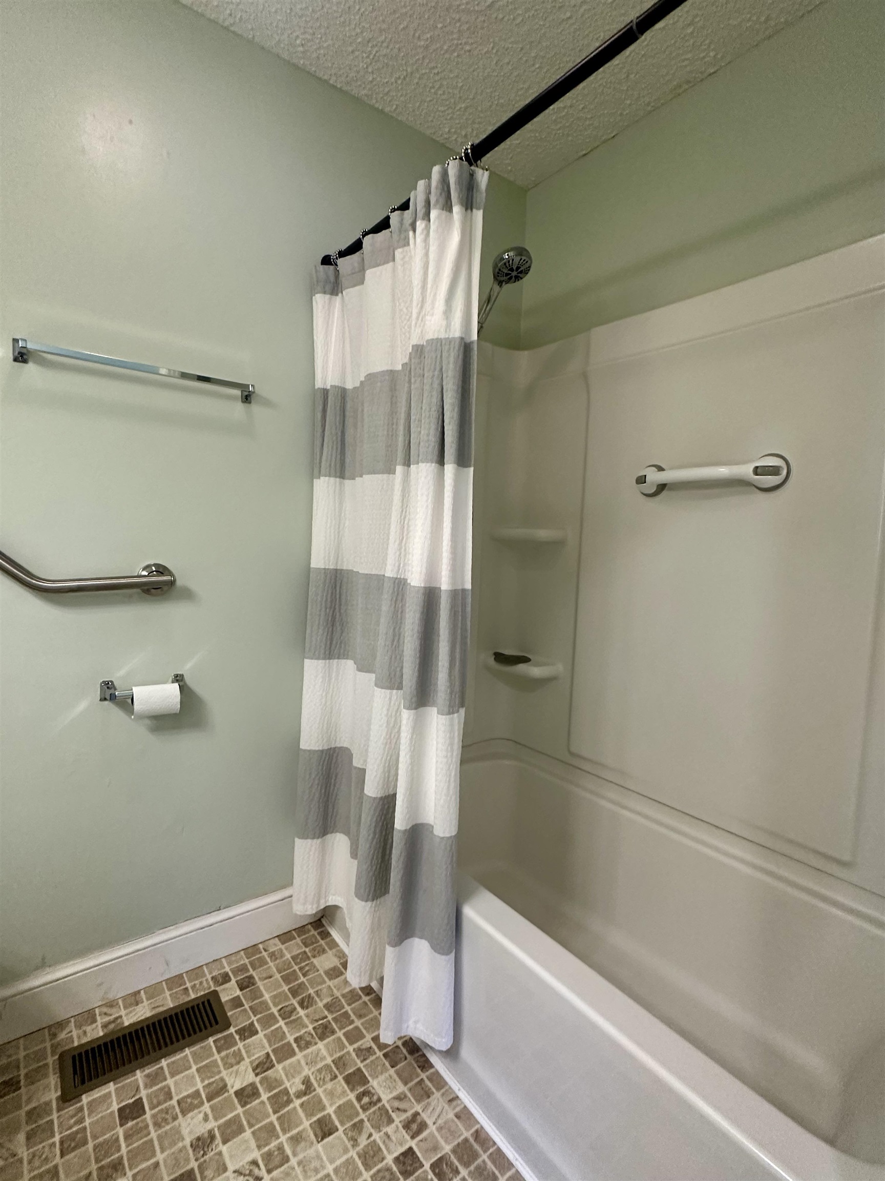 170 Mitchell Street Selmer, TN 38375 - Photo 18 of 26 a bathroom with a shower and a toilet