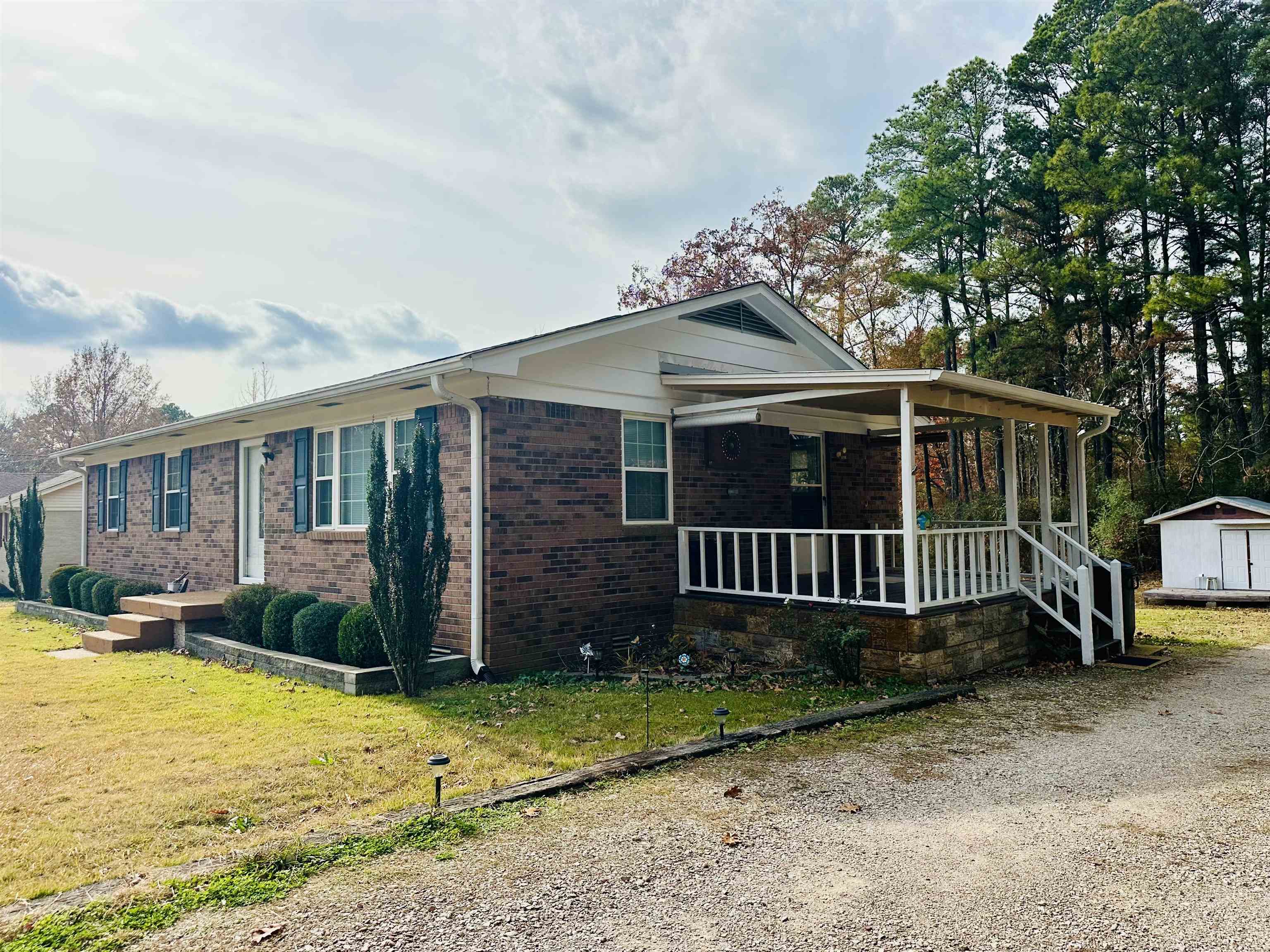 170 Mitchell Street Selmer, TN 38375 - Photo 7 of 26 a view of a house with a yard