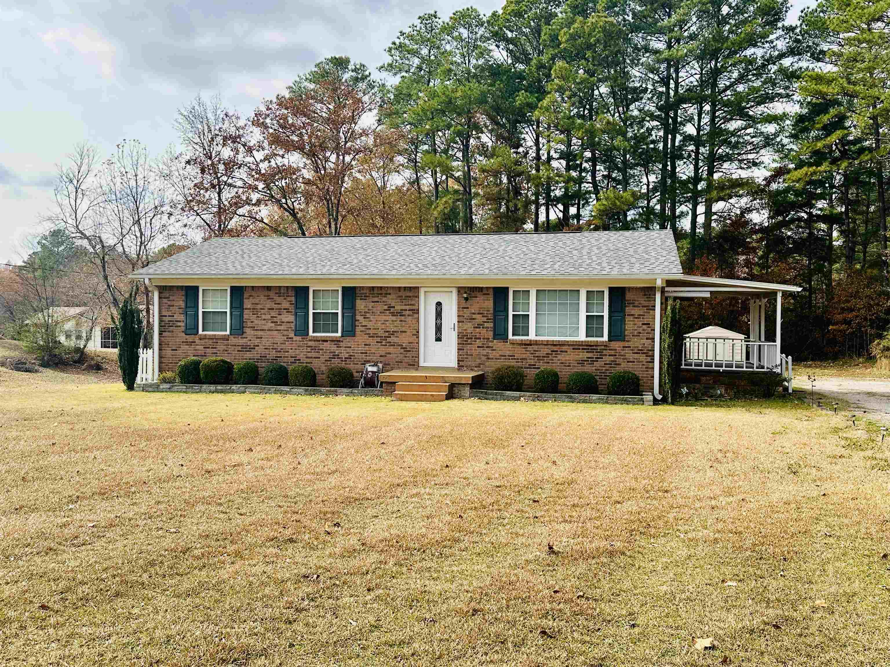 170 Mitchell Street Selmer, TN 38375 - Photo 9 of 26 Ranch-style home with a front lawn and brick siding