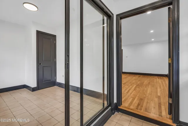 a view of walk in closet with living room