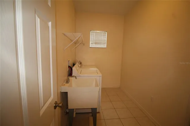 a bathroom with a sink and mirror