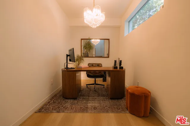 a roof deck with a table and chairs
