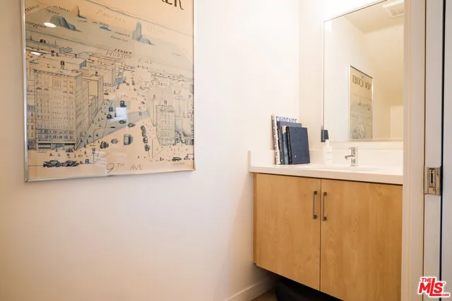 a large bed sitting in a bedroom next to a window