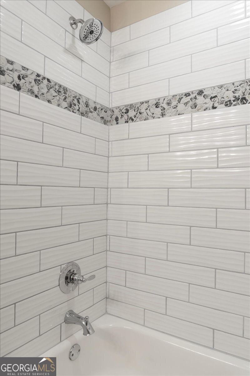 323 South Madison Avenue Monroe, GA 30655 - Photo 24 of 39 a bathroom with a shower