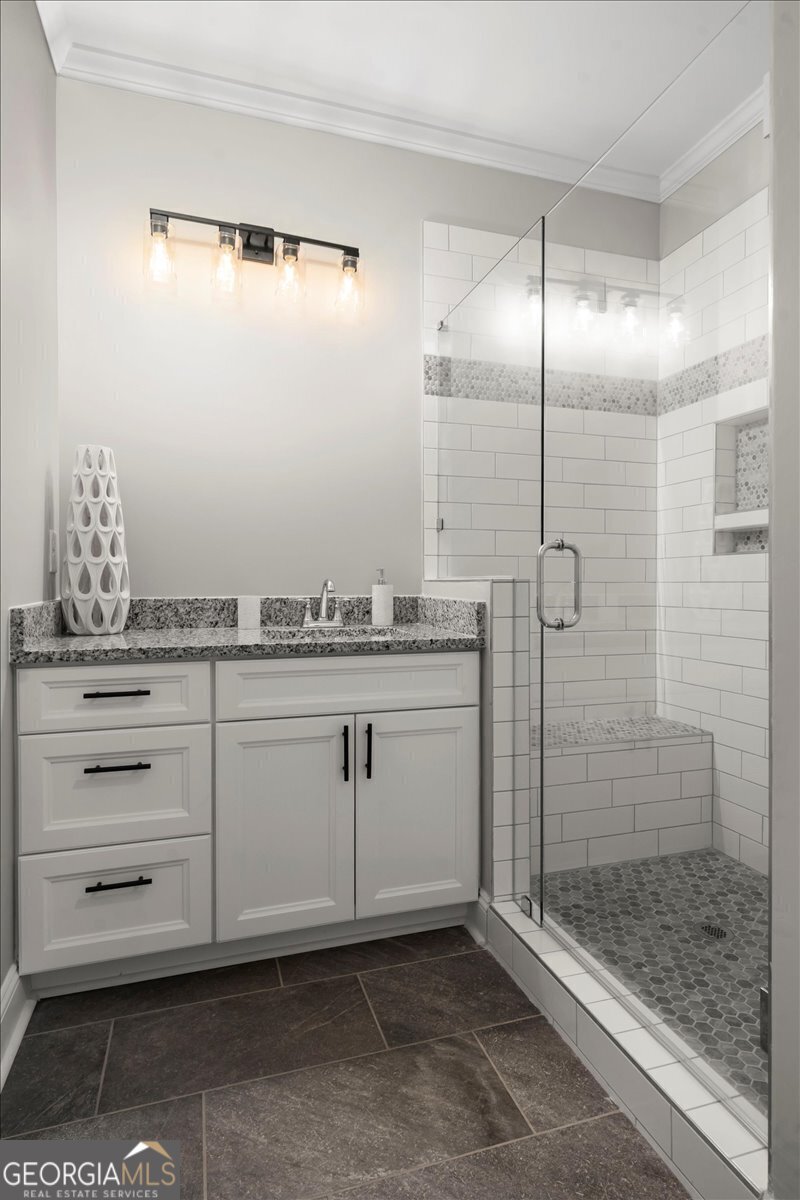 323 South Madison Avenue Monroe, GA 30655 - Photo 26 of 39 a bathroom with a shower and a sink