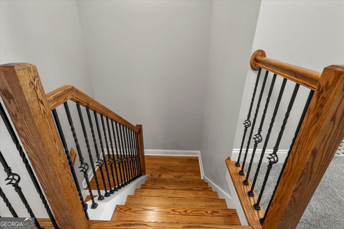 323 South Madison Avenue Monroe, GA 30655 - Photo 32 of 39 a view of a hallway with wooden floor