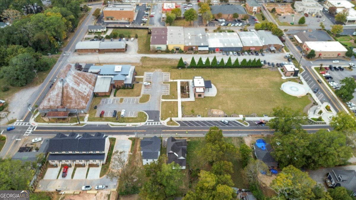 323 South Madison Avenue Monroe, GA 30655 - Photo 38 of 39 an aerial view of residential houses with outdoor space and lake view
