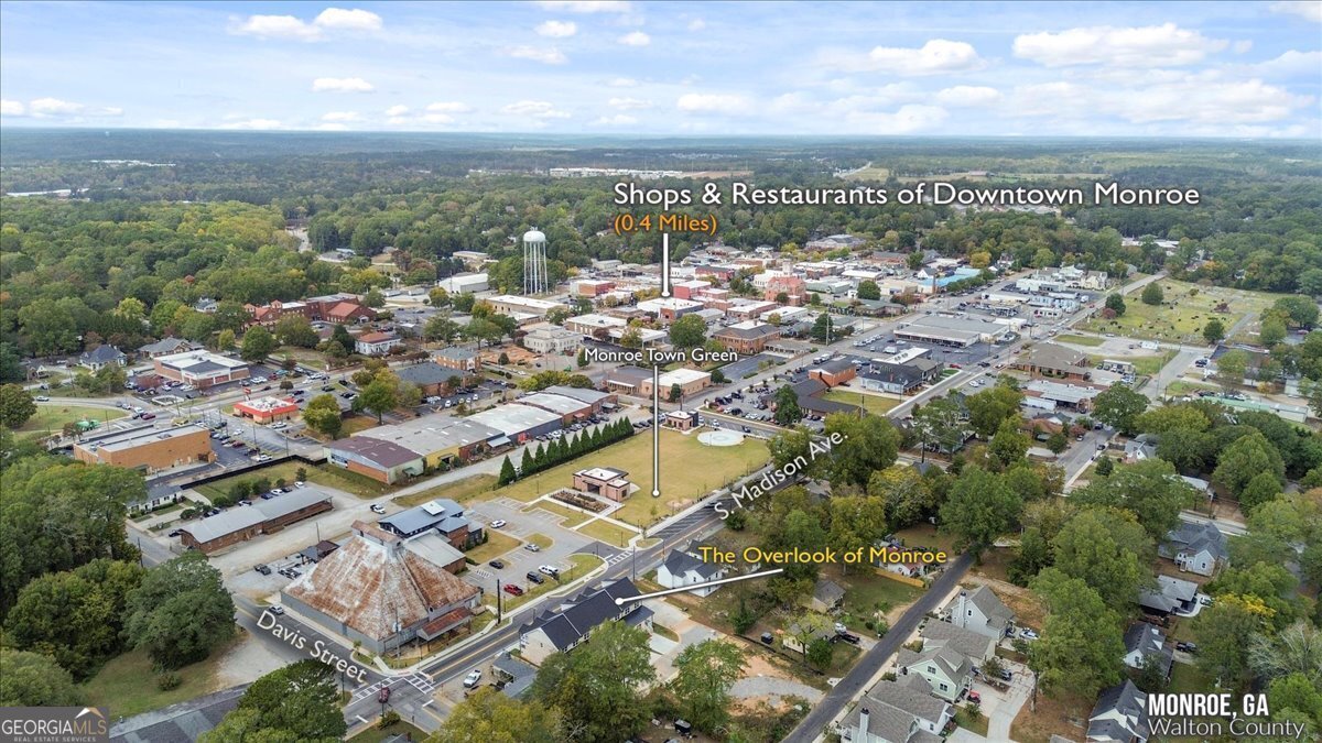 323 South Madison Avenue Monroe, GA 30655 - Photo 39 of 39 an aerial view of residential building with parking space
