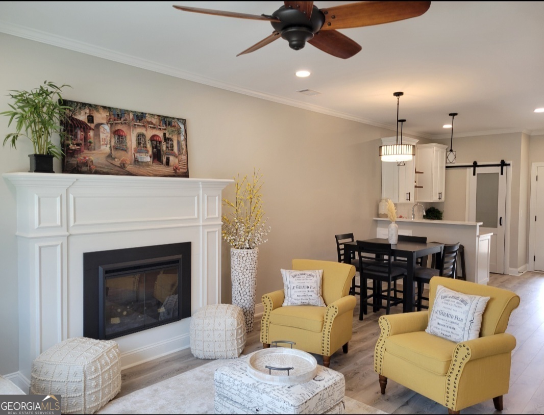 323 South Madison Avenue Monroe, GA 30655 - Photo 4 of 39 a living room with furniture and a fireplace