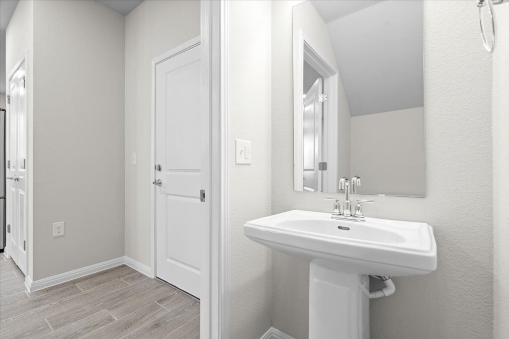 9015 Cattle Baron Path, Unit 705 Austin, TX 78747 - Photo 16 of 35 a bathroom with a sink and a mirror