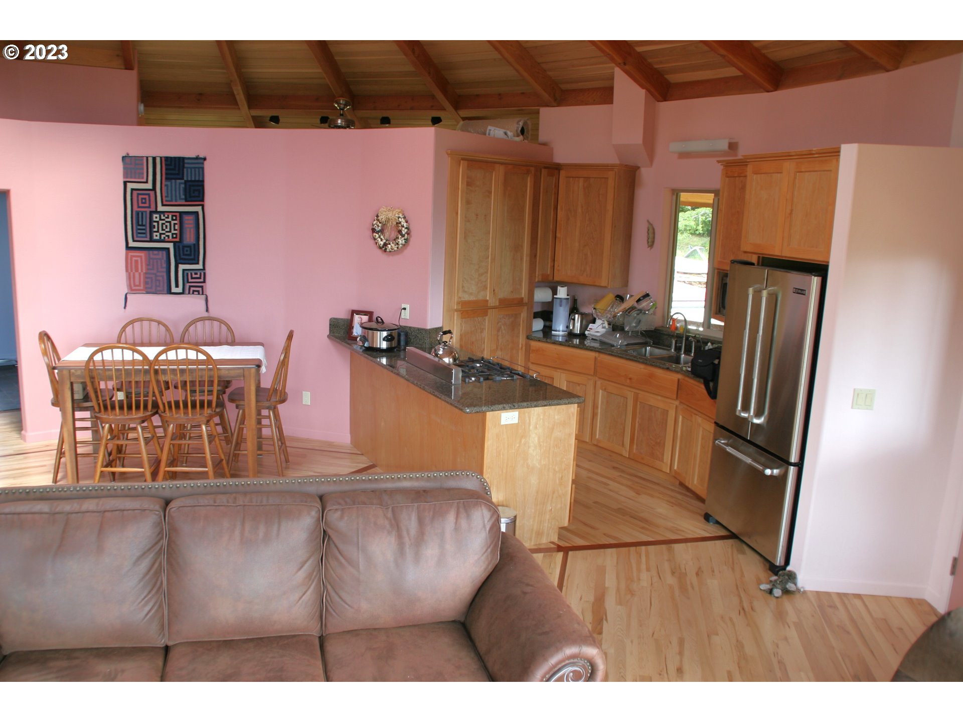 35606 Coy Creek Road Gold Beach, OR 97444 - Photo 14 of 48 a kitchen with granite countertop a refrigerator and a stove top oven