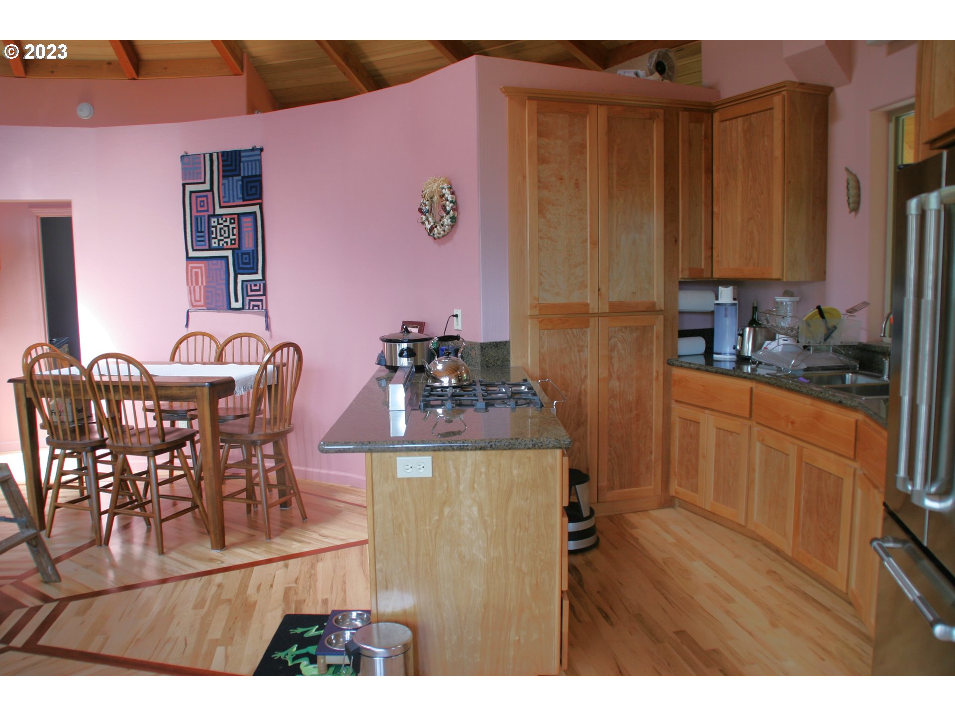 35606 Coy Creek Road Gold Beach, OR 97444 - Photo 15 of 48 a dining room with furniture and wooden floor