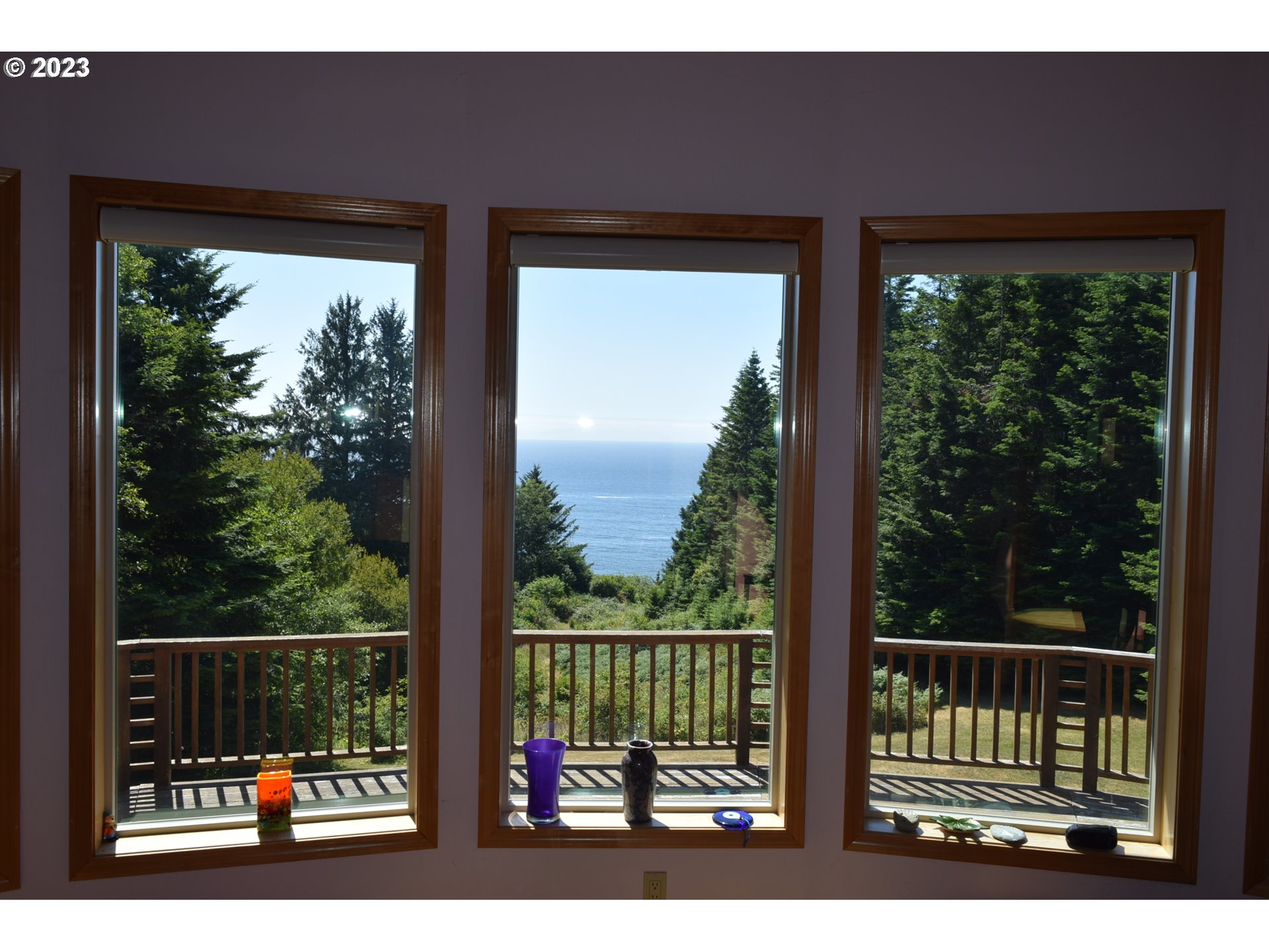 35606 Coy Creek Road Gold Beach, OR 97444 - Photo 18 of 48 a balcony with an outdoor view