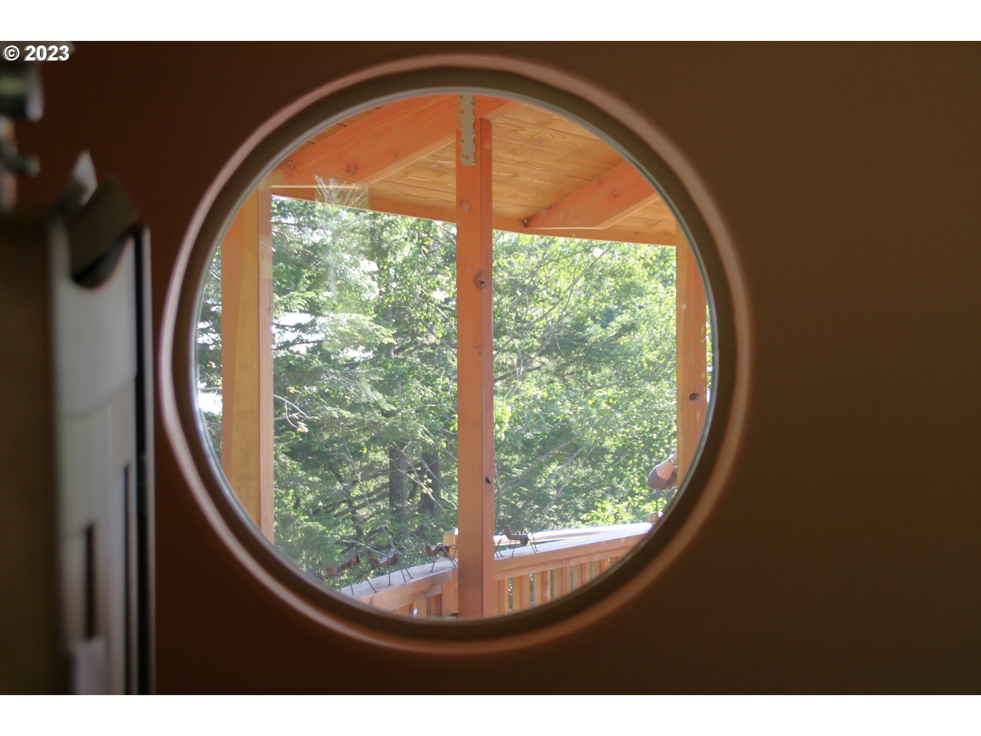 35606 Coy Creek Road Gold Beach, OR 97444 - Photo 28 of 48 a view of lot of trees from a window