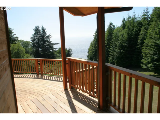 a view of balcony with wooden floor
