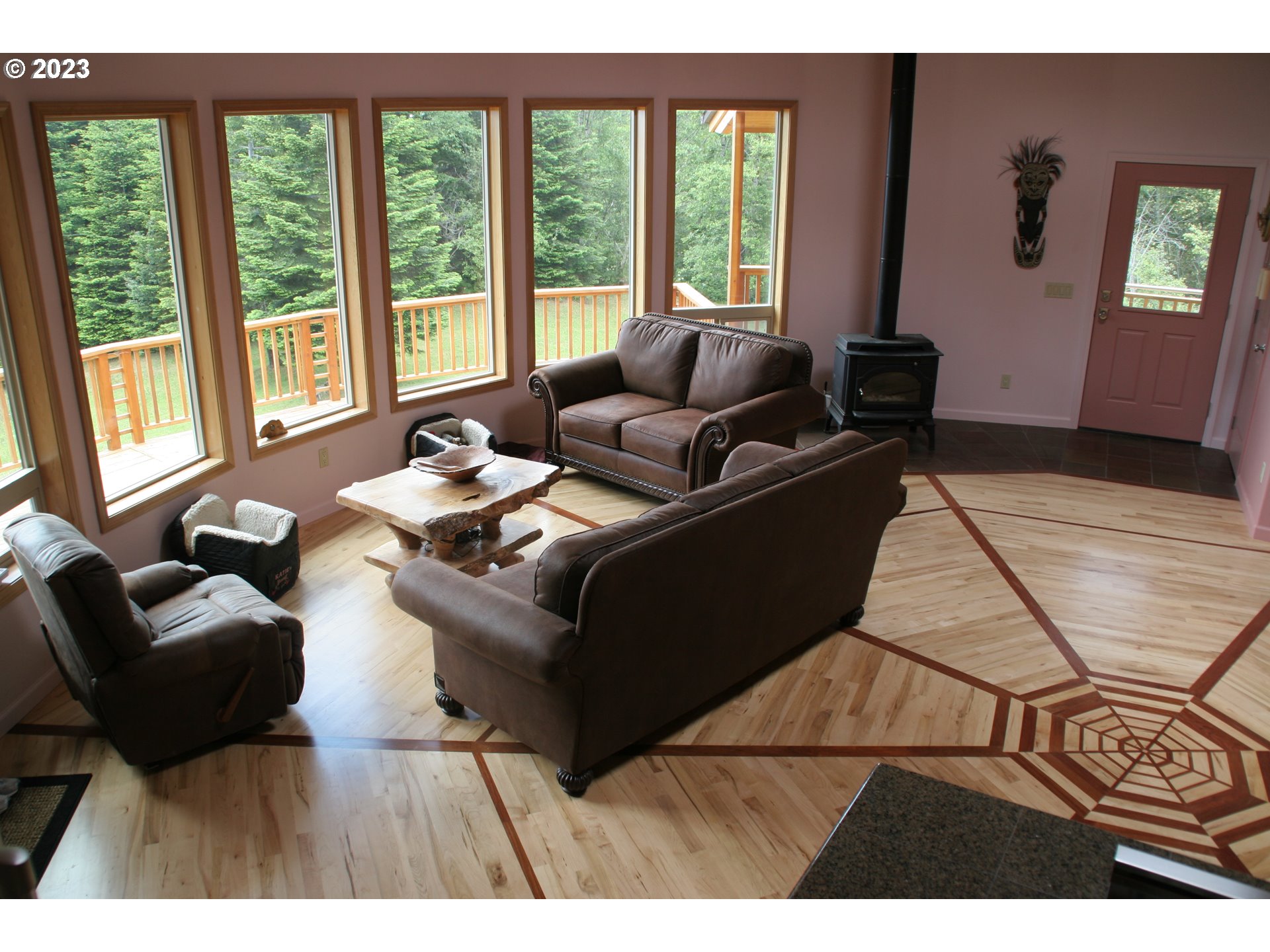 35606 Coy Creek Road Gold Beach, OR 97444 - Photo 10 of 48 a living room with furniture and a floor to ceiling window