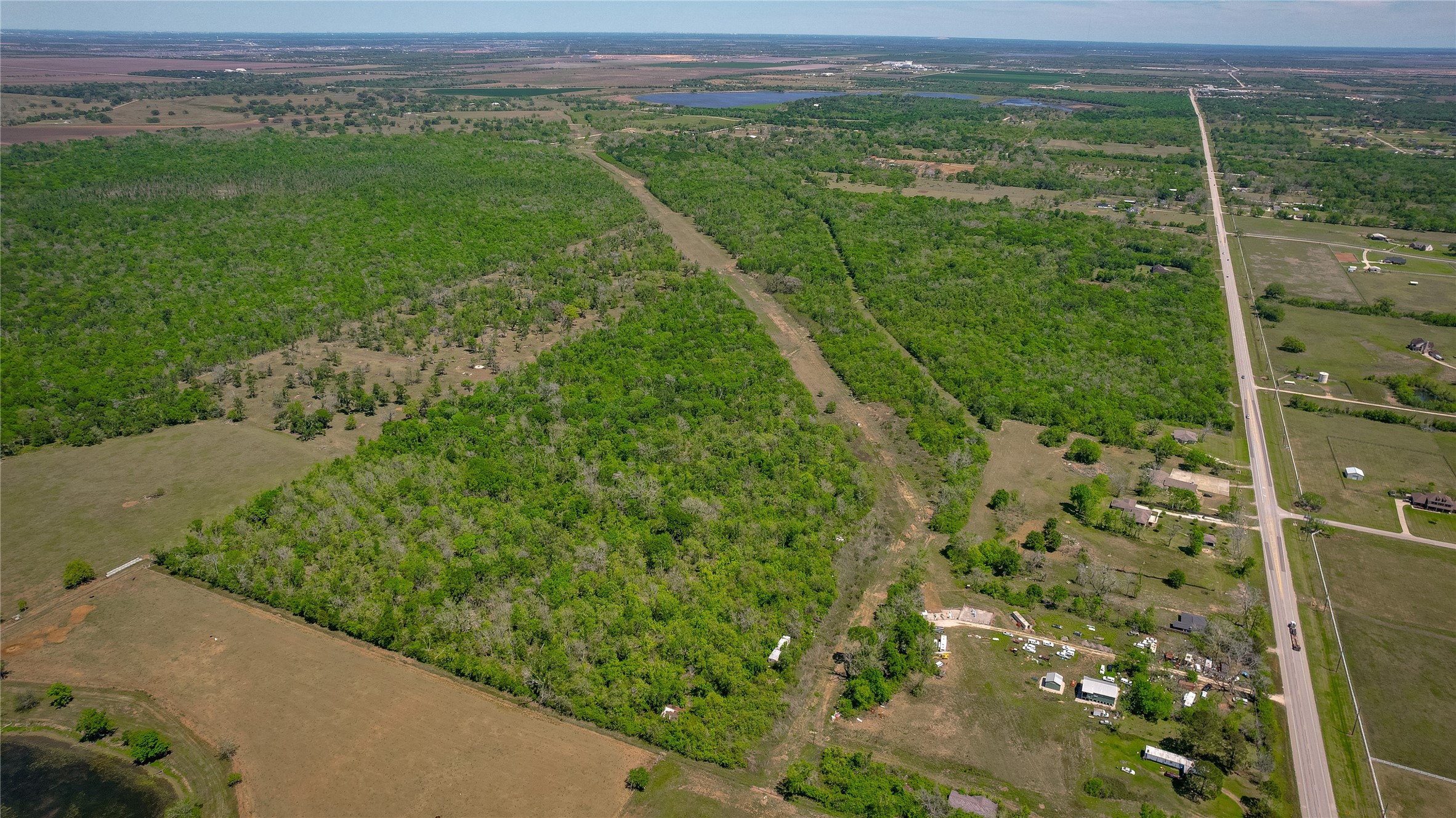 2932 West Farm To Market 1462 Rosharon, TX 77583 - Photo 13 of 20 a view of a lush green outdoor space with a lake view