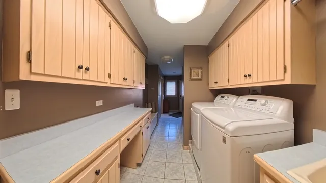 a view of a storage & utility room with washer and dryer