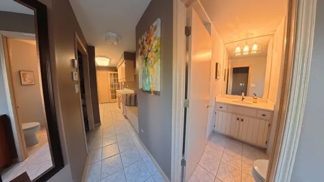 a view of a bathroom from the hallway