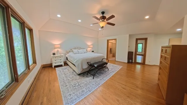 a bed room with a bed and a mirror