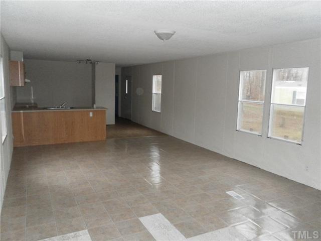 306 Colonial Estates Road Roxboro, NC 27574 - Photo 4 of 8 an empty room with windows