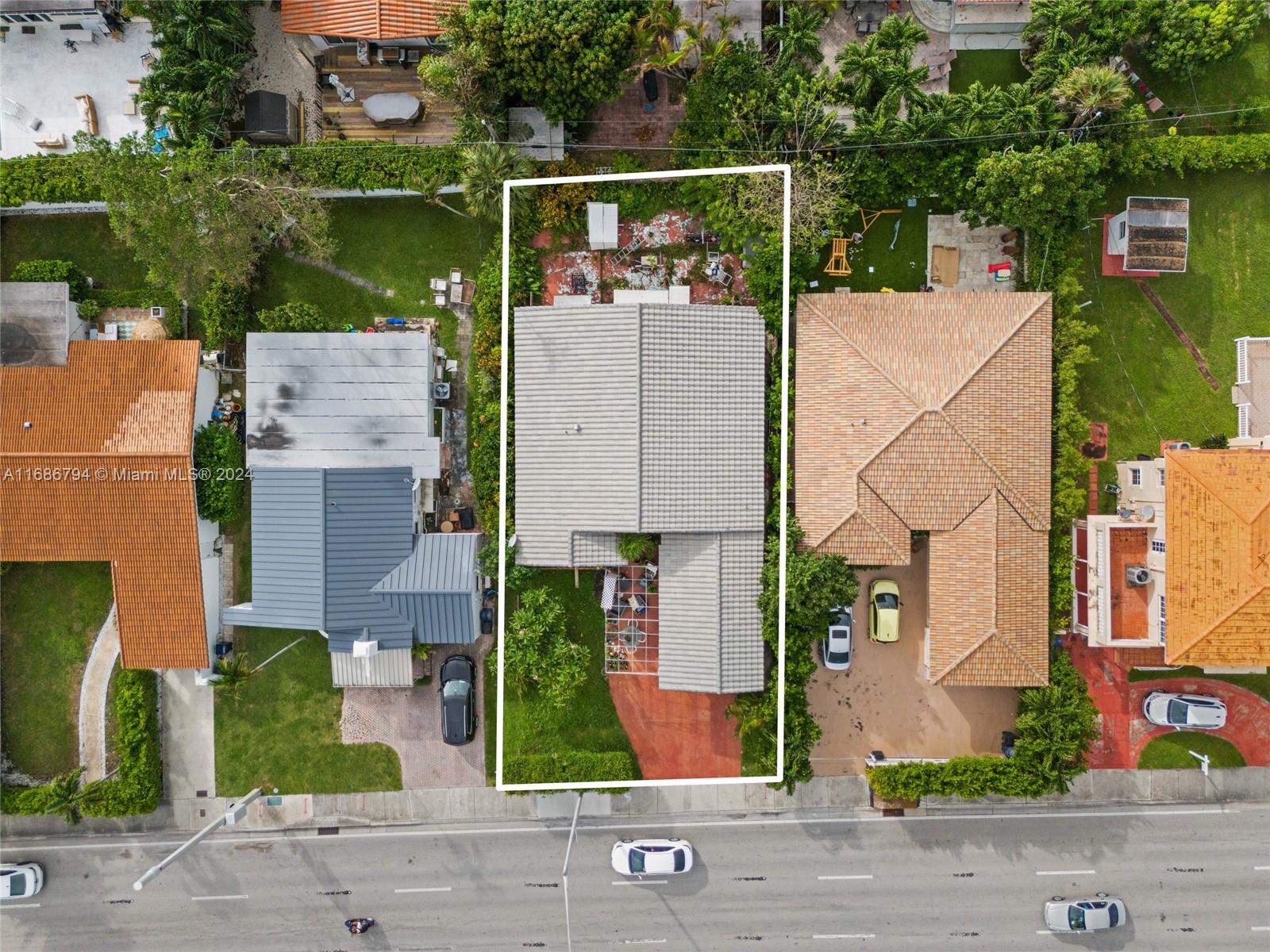 Surfside Surfside, FL 33154 - Photo 2 of 8 an aerial view of a house with garden space and street view