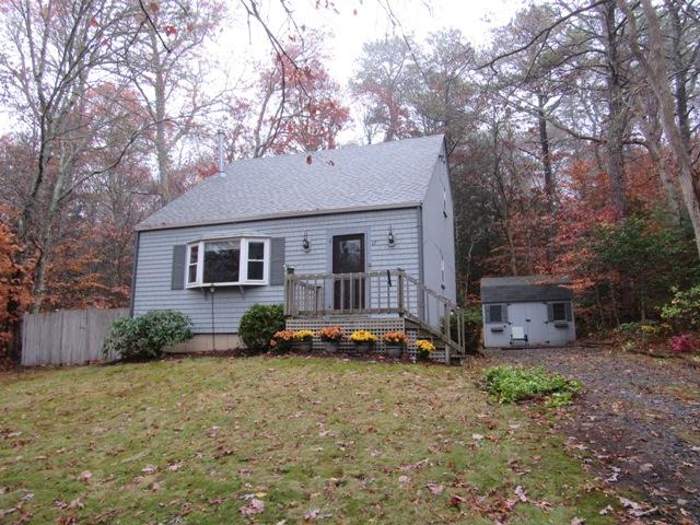 67 Deerfield Road Mashpee, MA 02649 - Photo 1 of 27 a front view of a house with garden