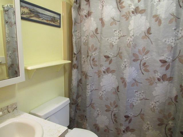 67 Deerfield Road Mashpee, MA 02649 - Photo 16 of 27 a bathroom with a sink and a toilet