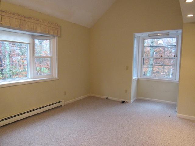 67 Deerfield Road Mashpee, MA 02649 - Photo 3 of 27 an empty room with windows