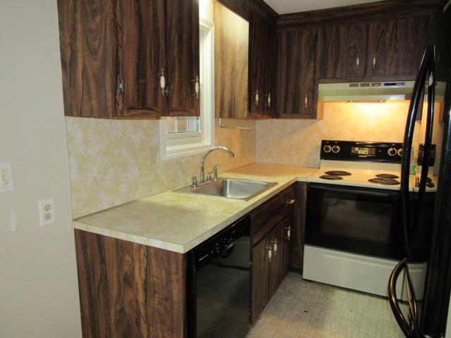 67 Deerfield Road Mashpee, MA 02649 - Photo 8 of 27 a kitchen with a sink and a stove top oven