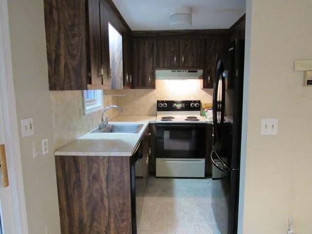 67 Deerfield Road Mashpee, MA 02649 - Photo 9 of 27 a kitchen with a stove and a sink