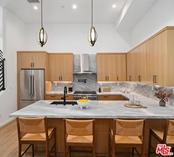 a kitchen with a sink cabinets and window