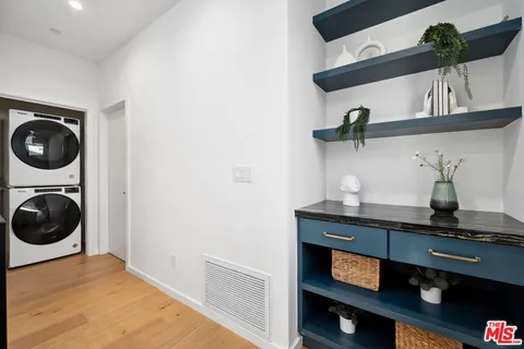 a bedroom with a bed and cupboard