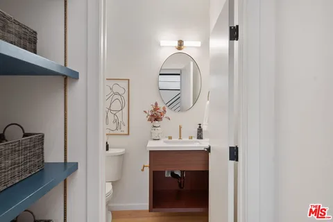 a bedroom with a bed and a a mirror