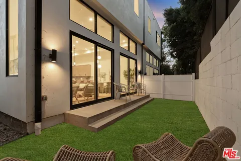 a front view of a house with parking space
