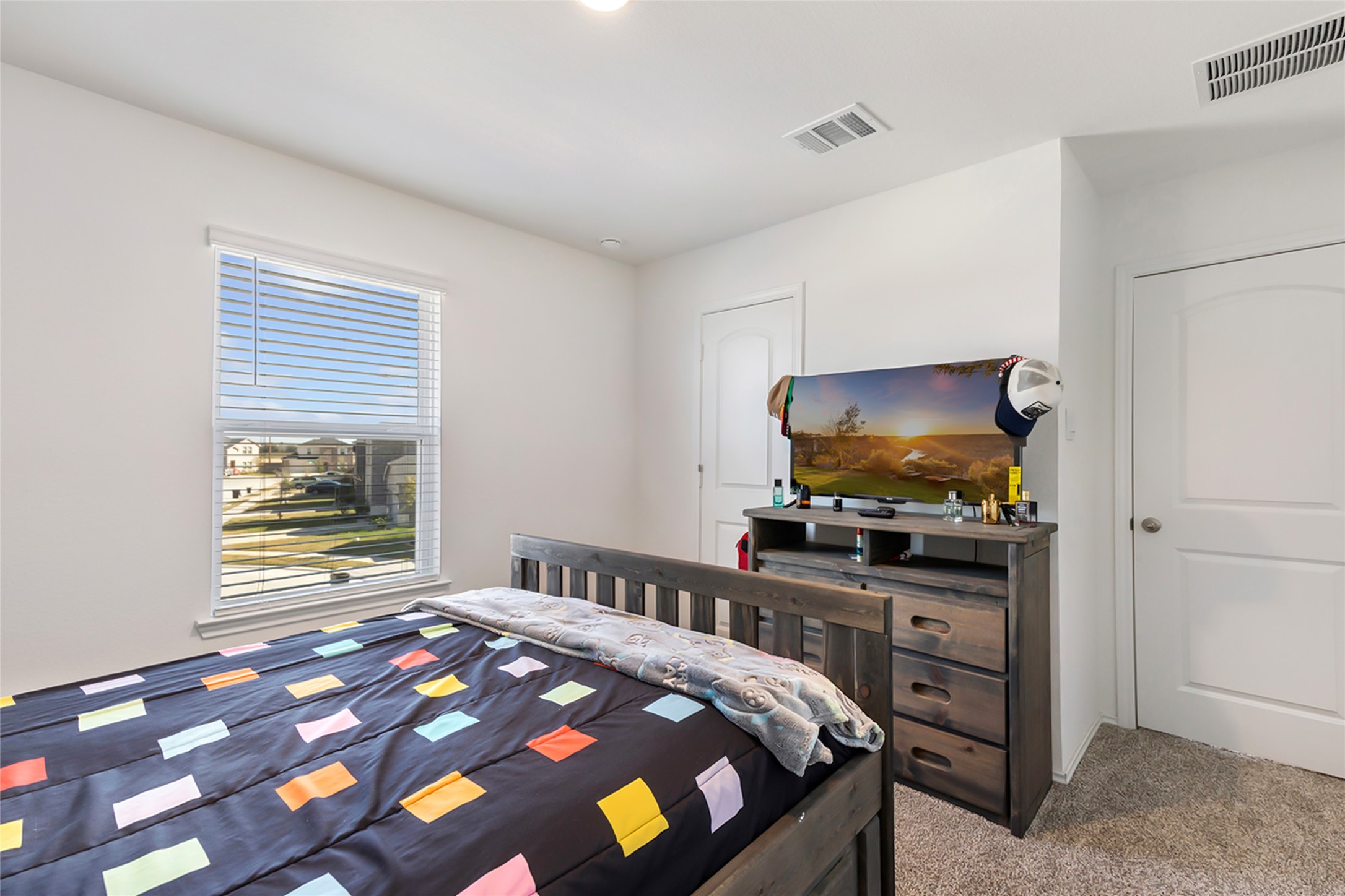 306 Springfield Shrs Court Crosby, TX 77532 - Photo 27 of 31 a bedroom with a bed and a flat screen tv