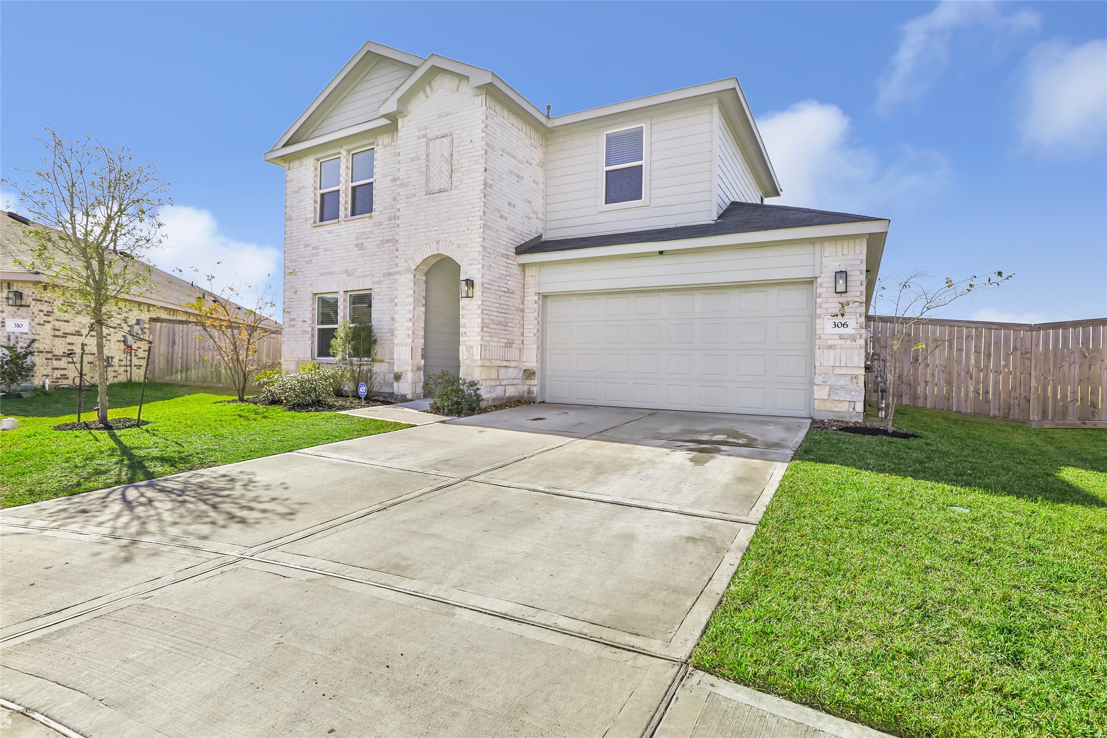306 Springfield Shrs Court Crosby, TX 77532 - Photo 4 of 31 a front view of a house with a yard and garage