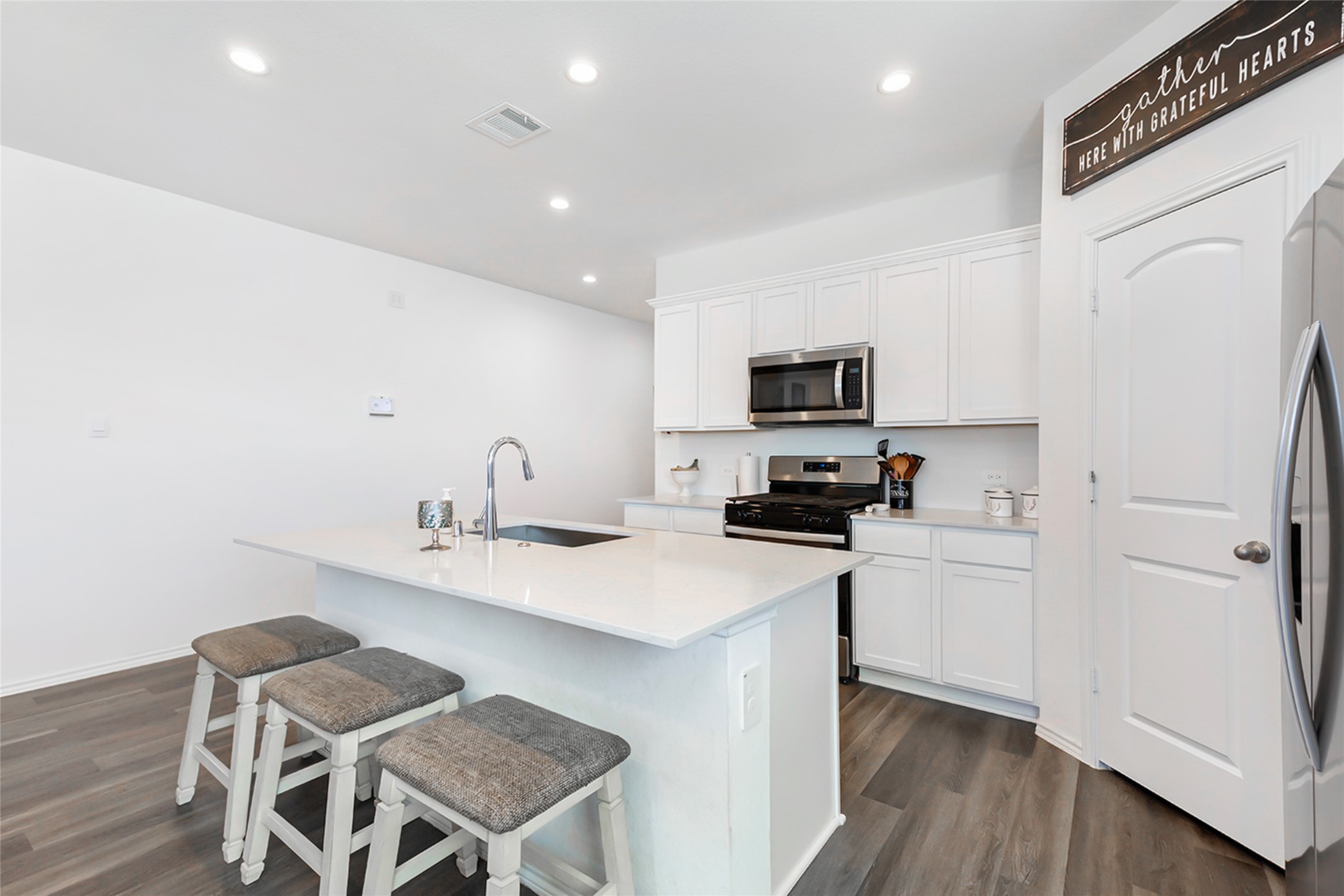 306 Springfield Shrs Court Crosby, TX 77532 - Photo 8 of 31 a kitchen with a sink cabinets and wooden floor