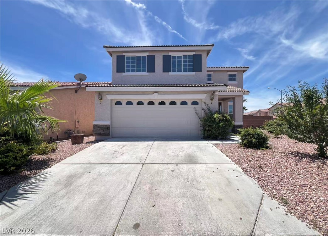 9891 Ridge Hill Avenue Las Vegas, NV 89147 - Photo 1 of 29 Discover a charming two-story residence featuring a two-car garage and drought-tolerant landscaping.