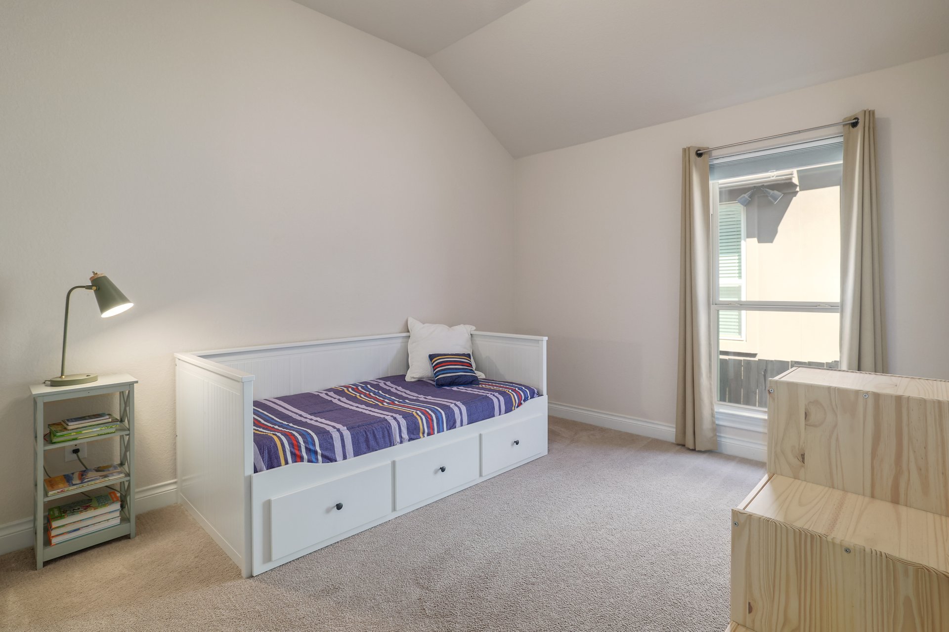 173 Santa Maria Street Georgetown, TX 78628 - Photo 28 of 39 Bedroom 3 featuring a single window, vaulted ceiling, and white baseboards
