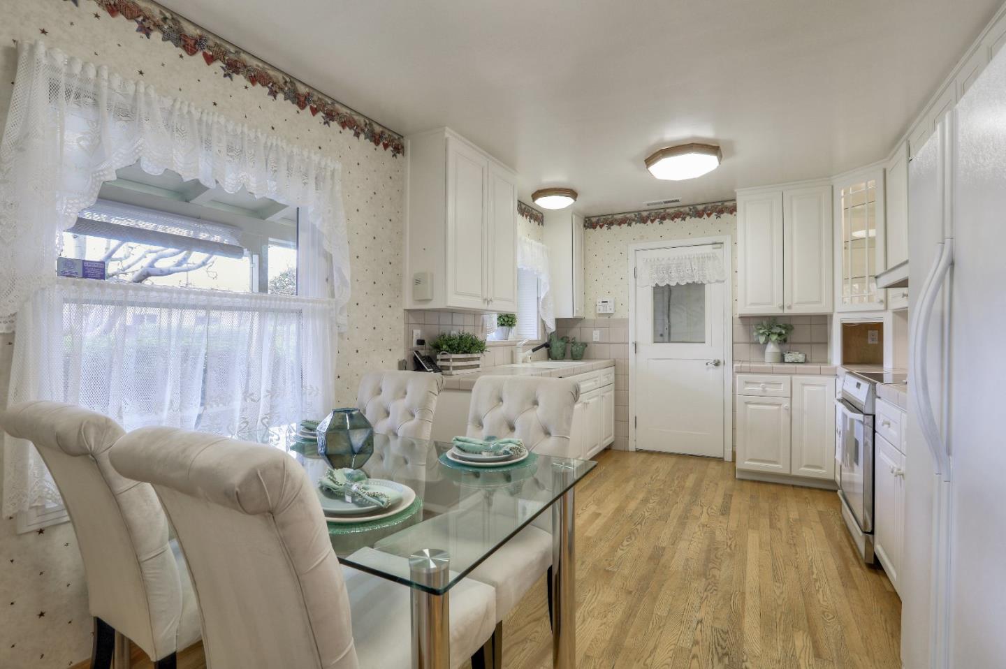 66 Church Street Mountain View, CA 94041 - Photo 11 of 45 a kitchen with stainless steel appliances kitchen island granite countertop a sink and cabinets
