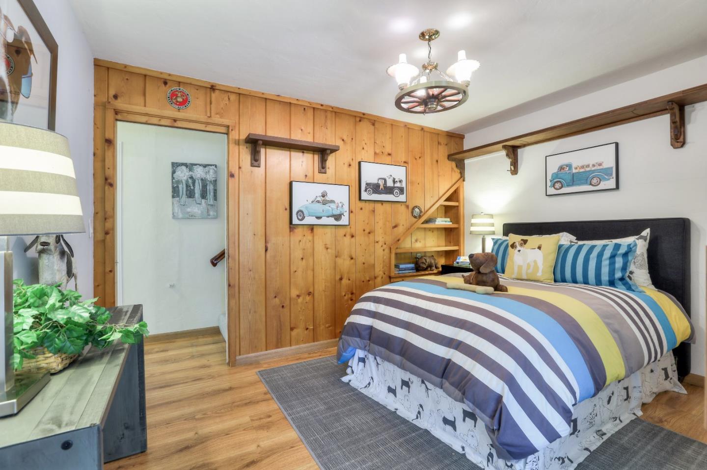 66 Church Street Mountain View, CA 94041 - Photo 15 of 45 a bedroom with bed and a chandelier