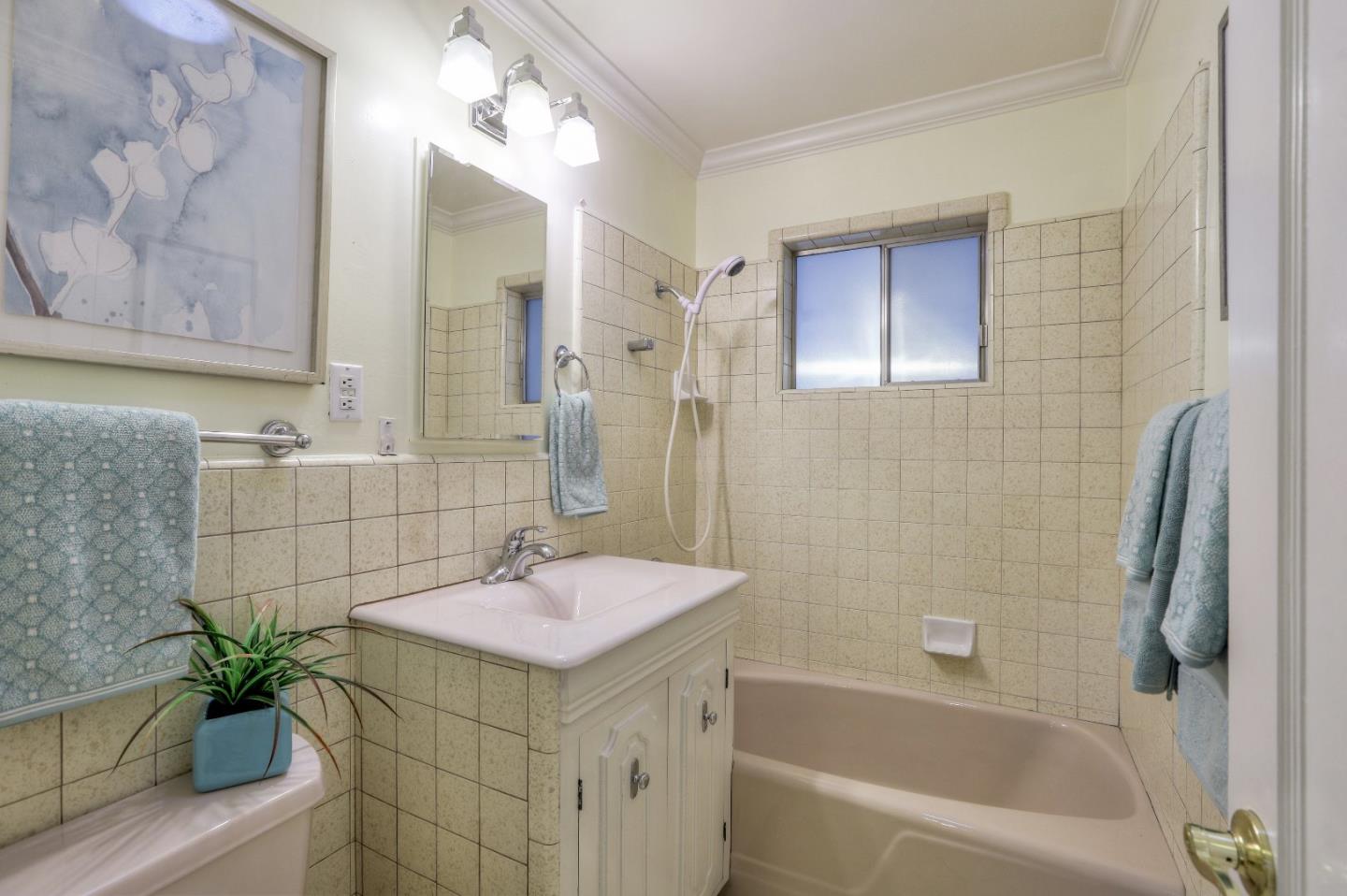 66 Church Street Mountain View, CA 94041 - Photo 18 of 45 a bathroom with a sink a bathtub a shower and a mirror