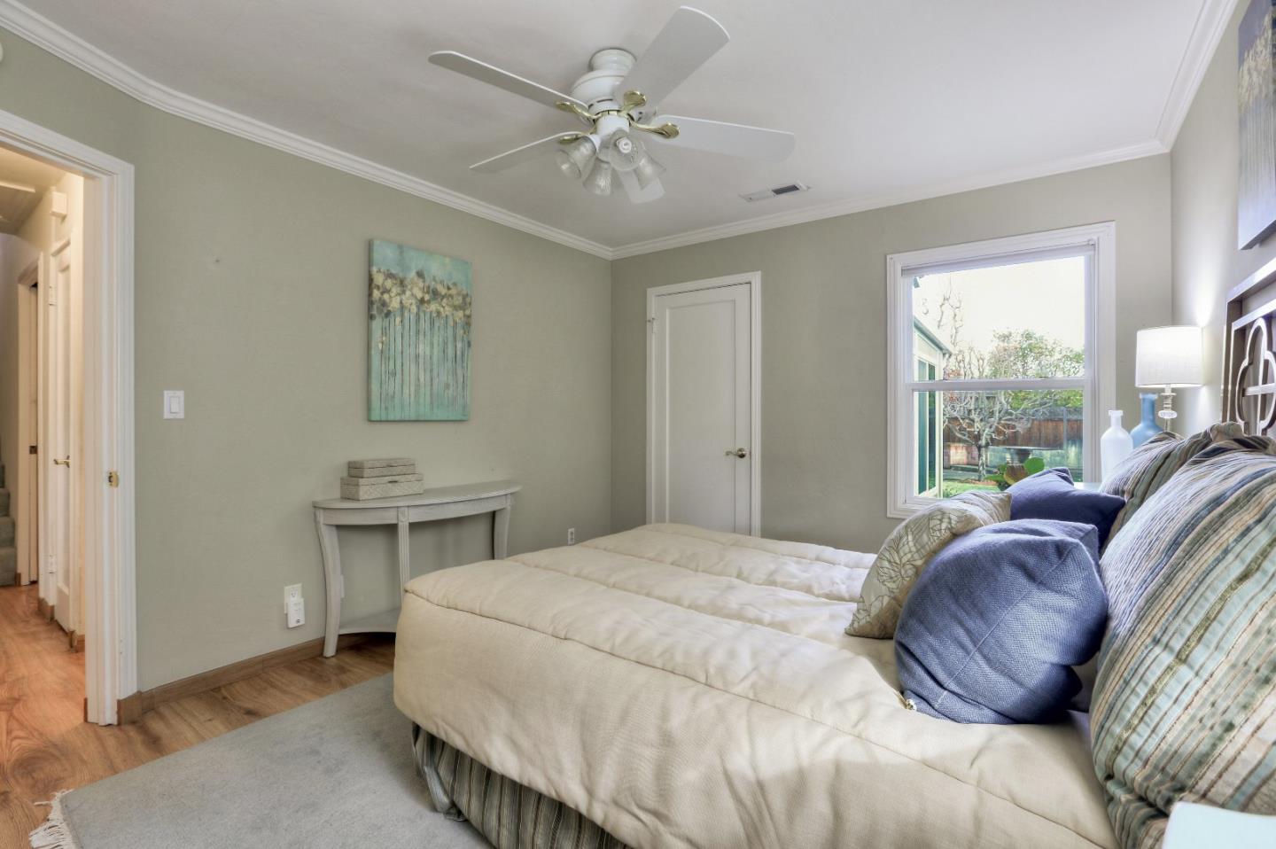 66 Church Street Mountain View, CA 94041 - Photo 22 of 45 a bedroom with a bed and a chandelier