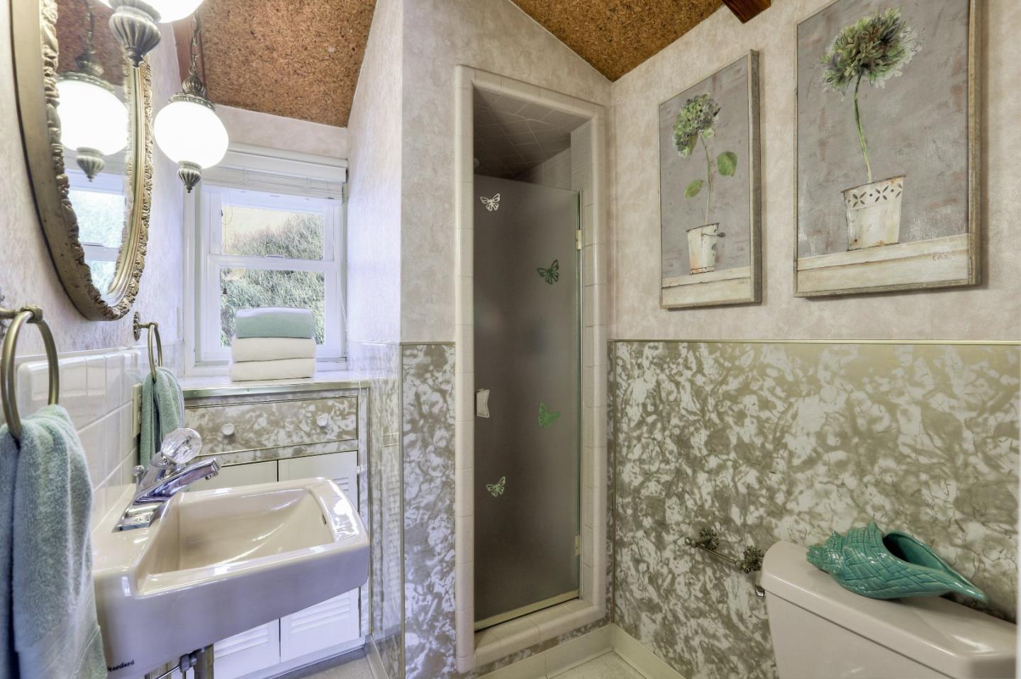 66 Church Street Mountain View, CA 94041 - Photo 28 of 45 a bathroom with a sink and mirror with bathtub