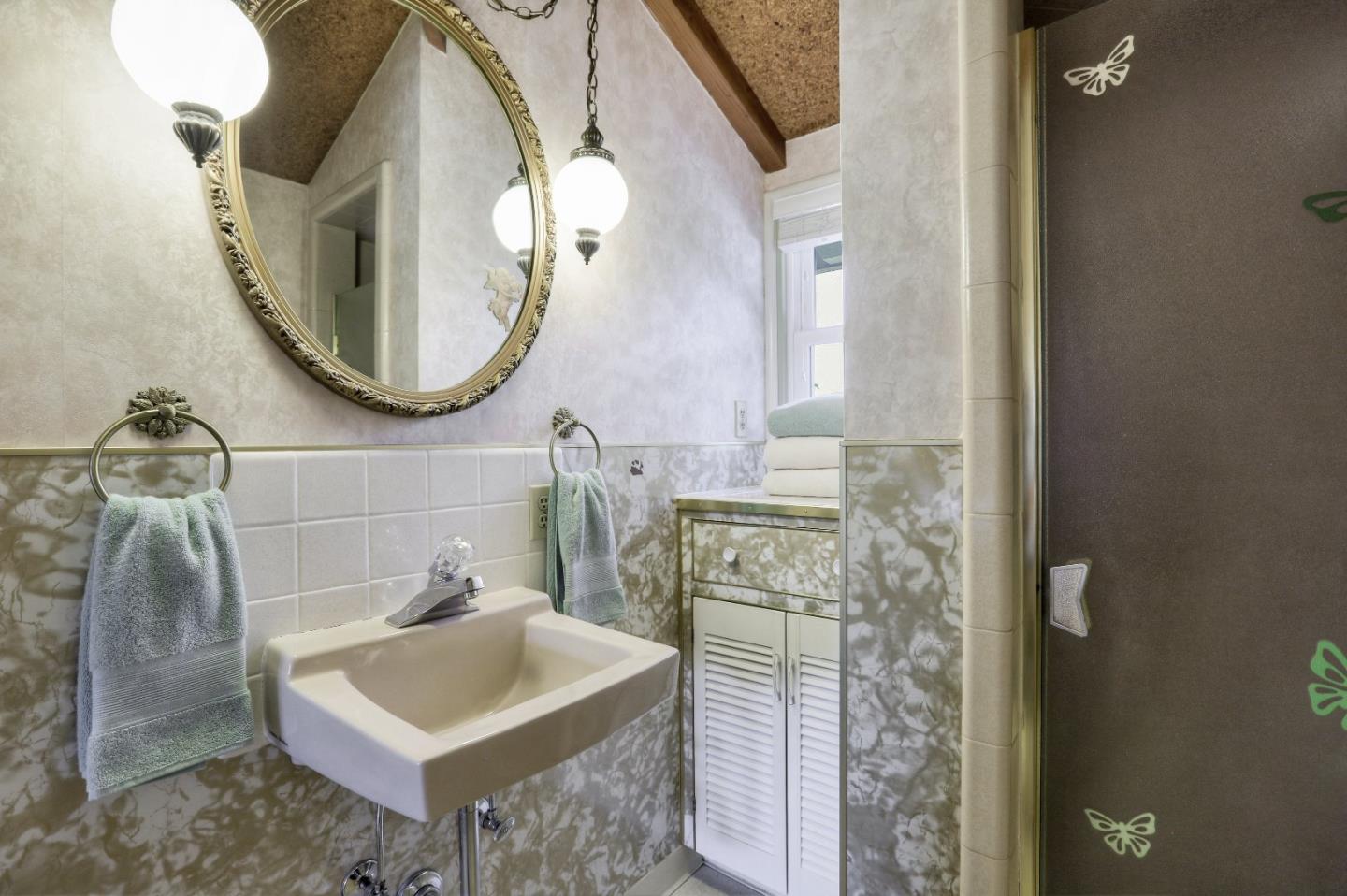 66 Church Street Mountain View, CA 94041 - Photo 29 of 45 wooden bathroom with a sink and a mirror