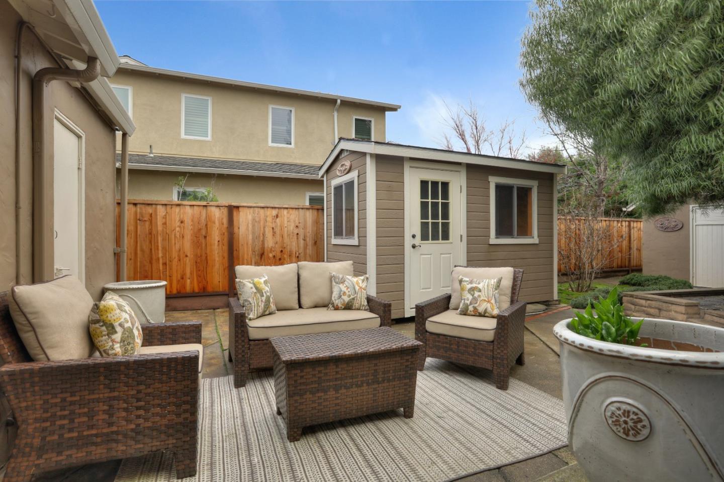 66 Church Street Mountain View, CA 94041 - Photo 35 of 45 a view of a patio with couches and a table and chairs with wooden floor