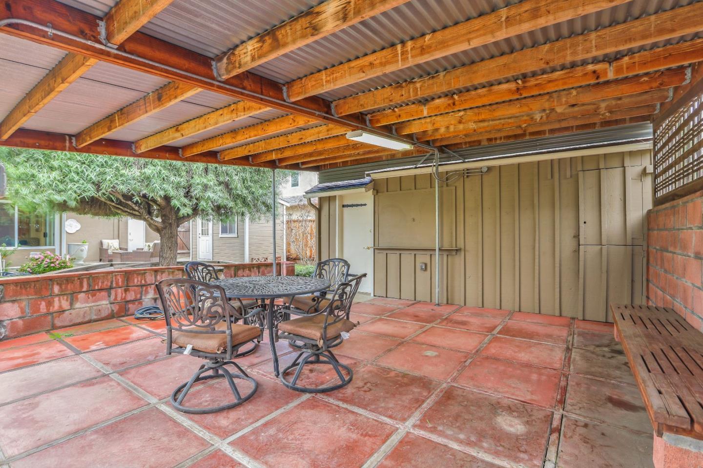 66 Church Street Mountain View, CA 94041 - Photo 38 of 45 a patio with table and chairs and potted plants