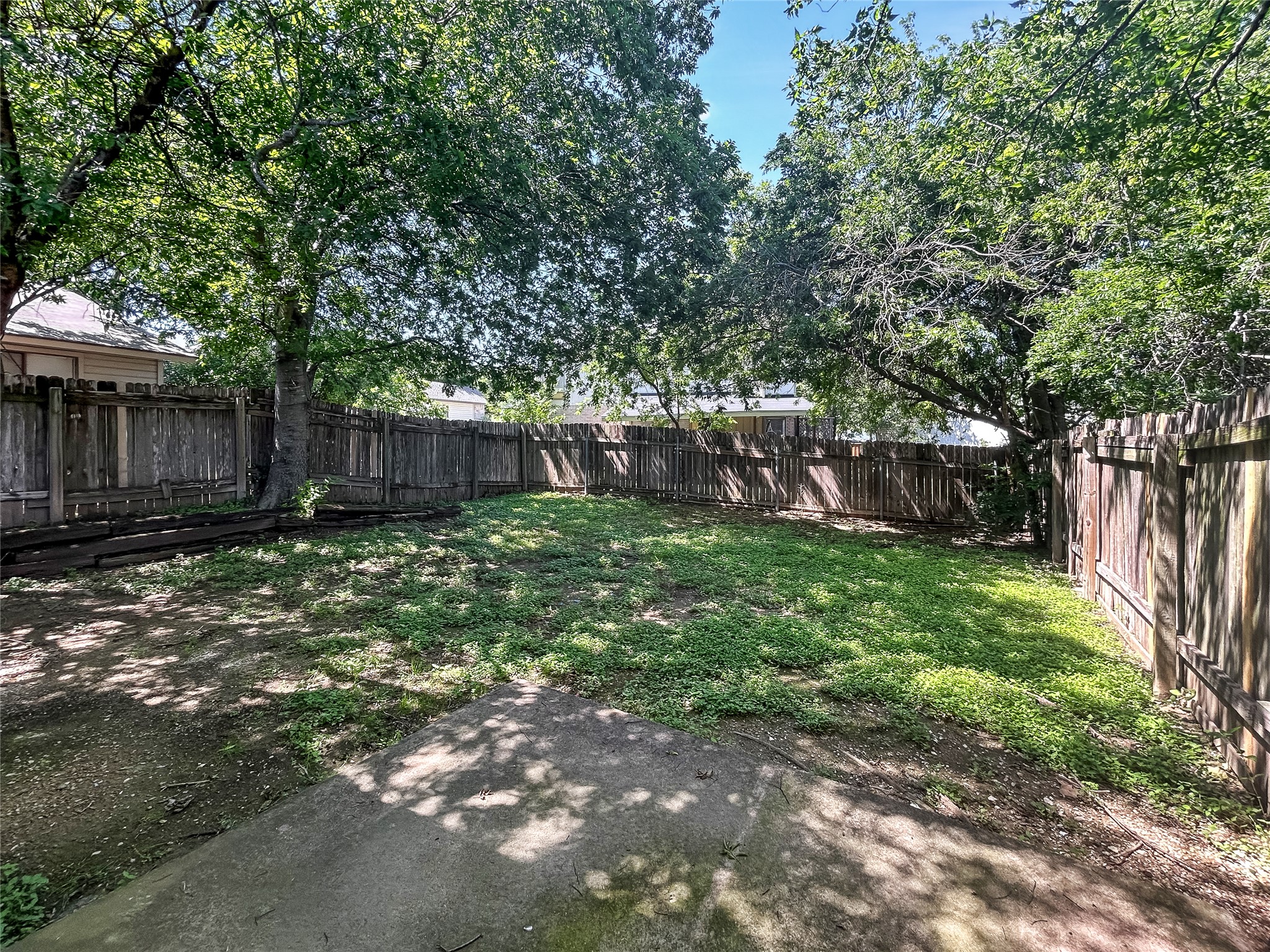 2008 Alex Avenue, Unit A Austin, TX 78728 - Photo 19 of 22 Backyard with a Covered Wooden Fence